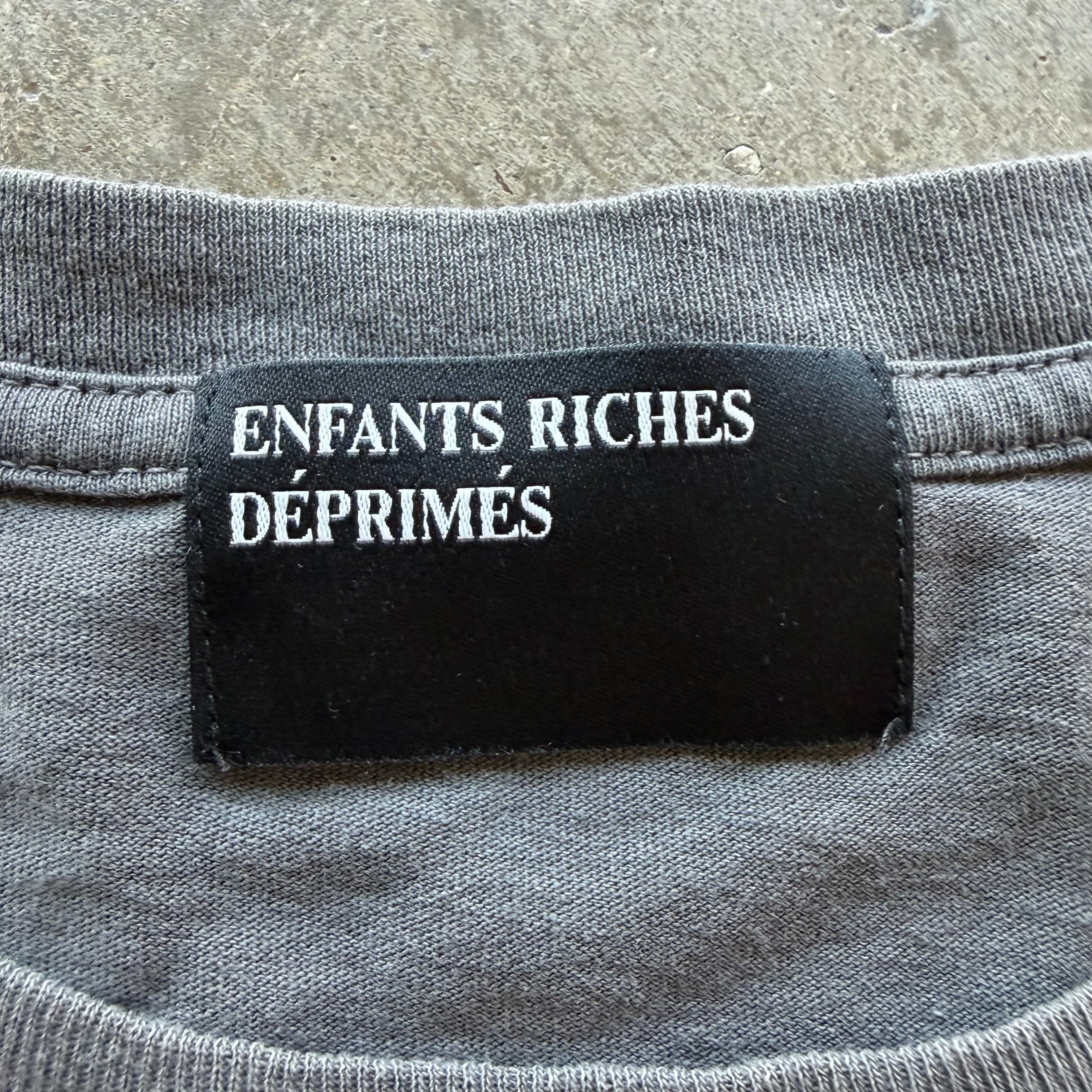 L Enfants Riches Deprimes Reality Of God L/S